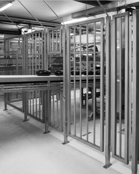Realised guarding with hinged doors in a production area